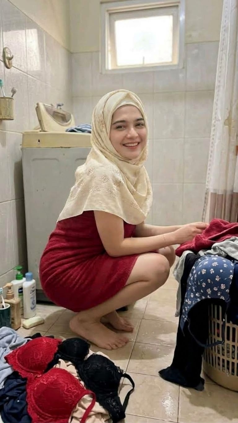 Portrait with a beige headscarf and red dress.