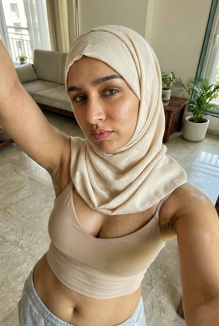 Portrait with a beige headscarf and neutral outfit.