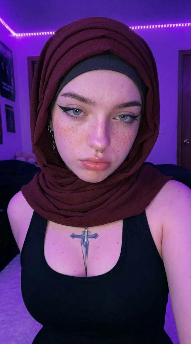 Portrait with a burgundy headscarf and purple lighting.