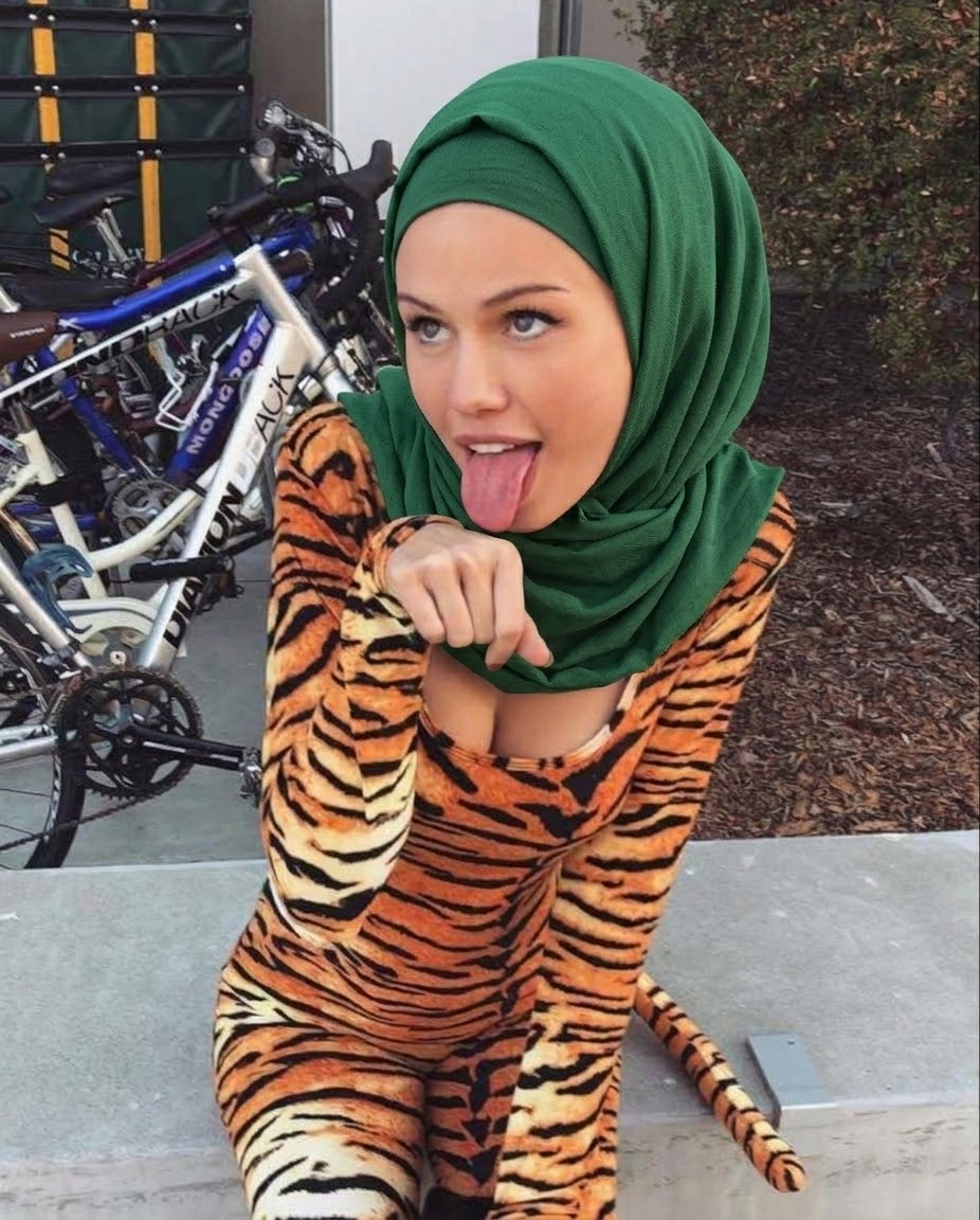Portrait with a green headscarf and animal-print top.