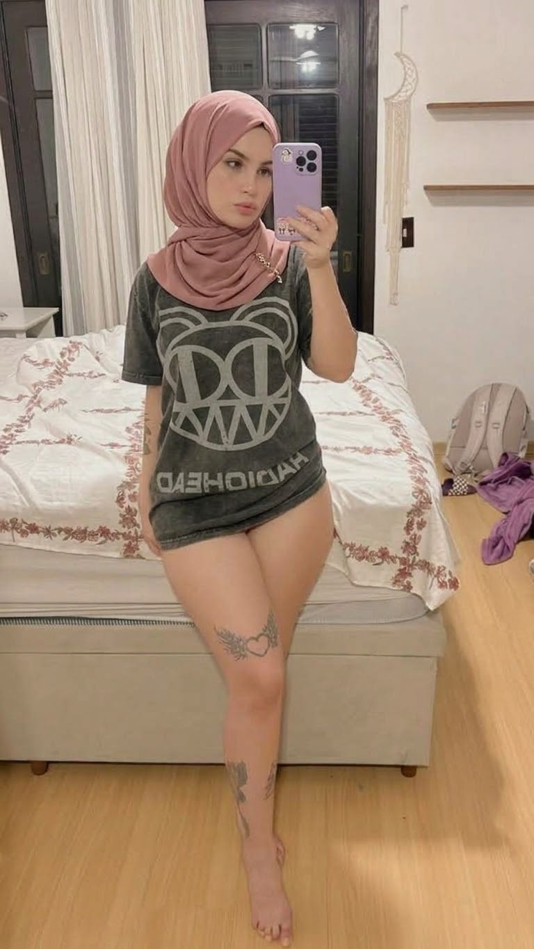 Portrait with a green headscarf and green outfit.