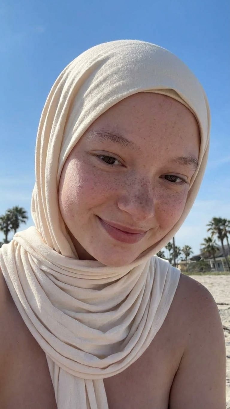 Portrait with a white headscarf and sunlight.